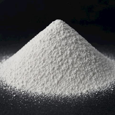 Pile of bright white titanium dioxide powder used as a pigment in paints, plastics, and coatings